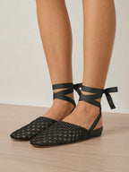 Veronica Beard Black woven leather ballet flats with ankle ties.
