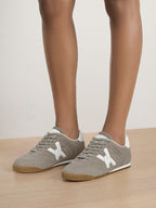 Veronica Beard Gray suede sneakers with white accents and gum soles.