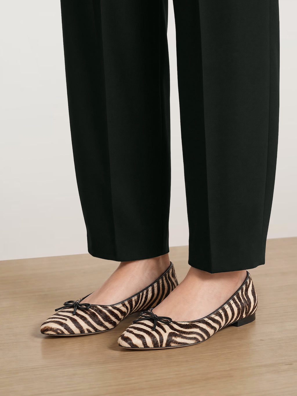 Veronica Beard Brown zebra-print leather flat shoes with bows.