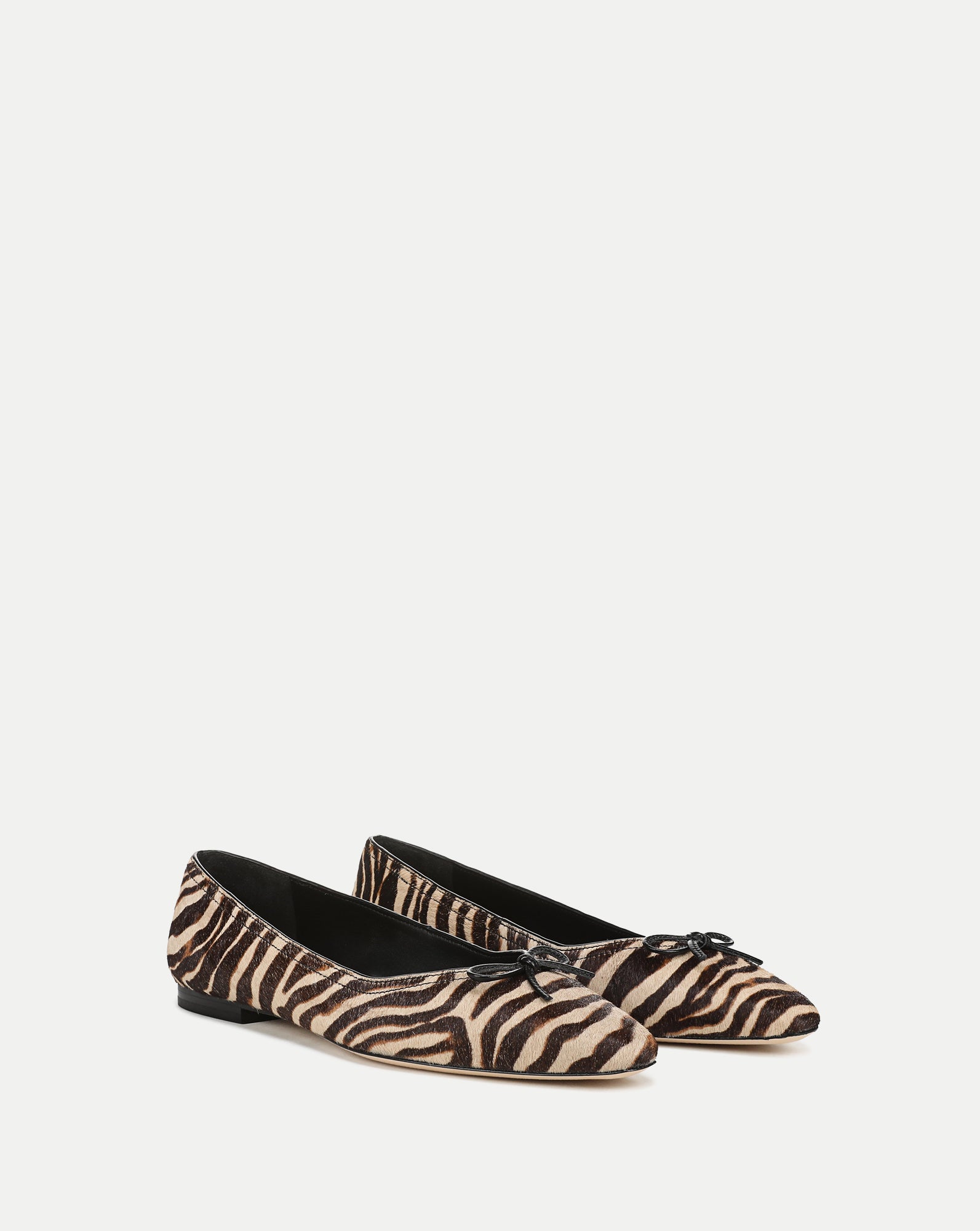 Veronica Beard Brown and beige zebra print bow ballet flats.