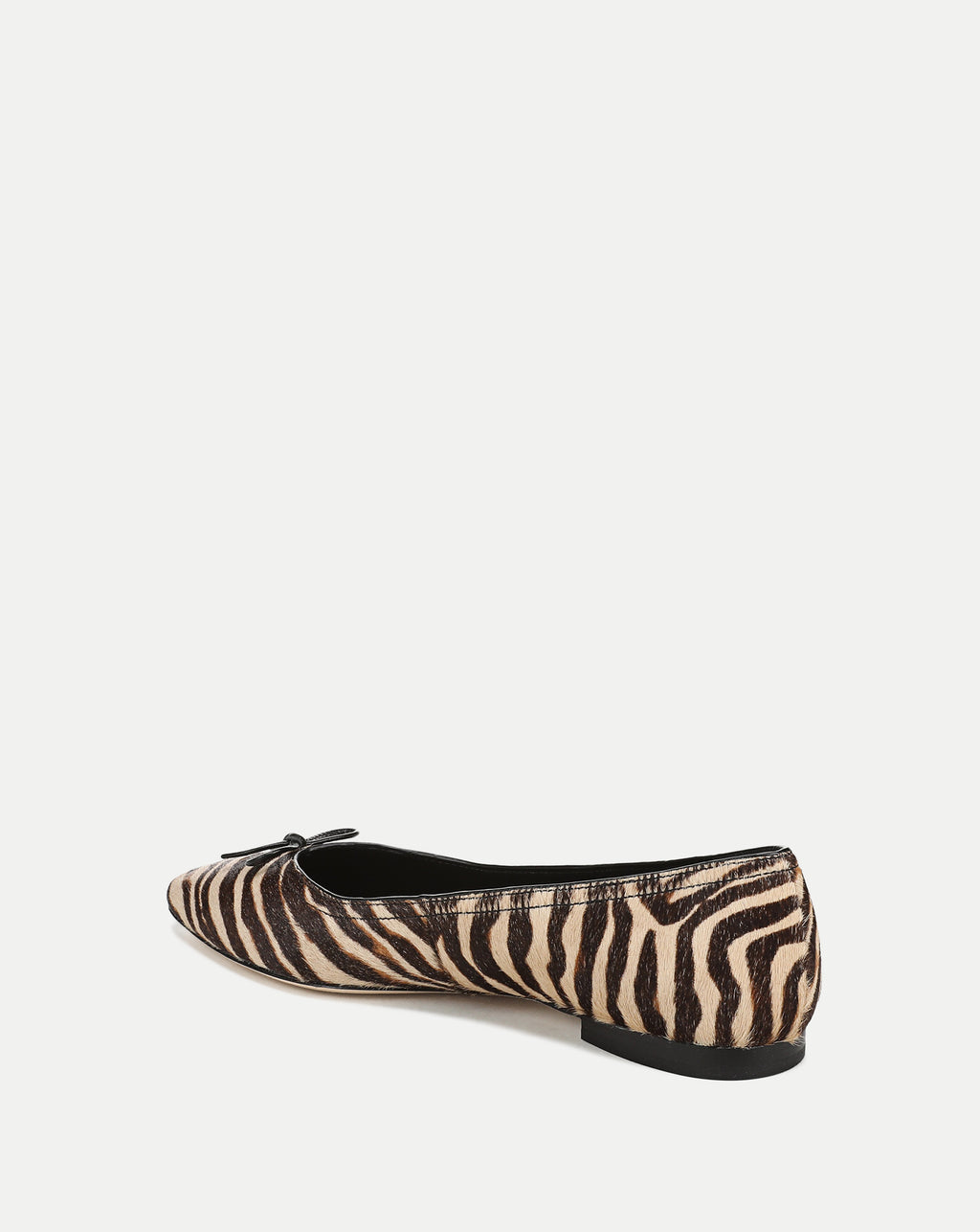 Veronica Beard Zebra print ballet flats with small bow detail.