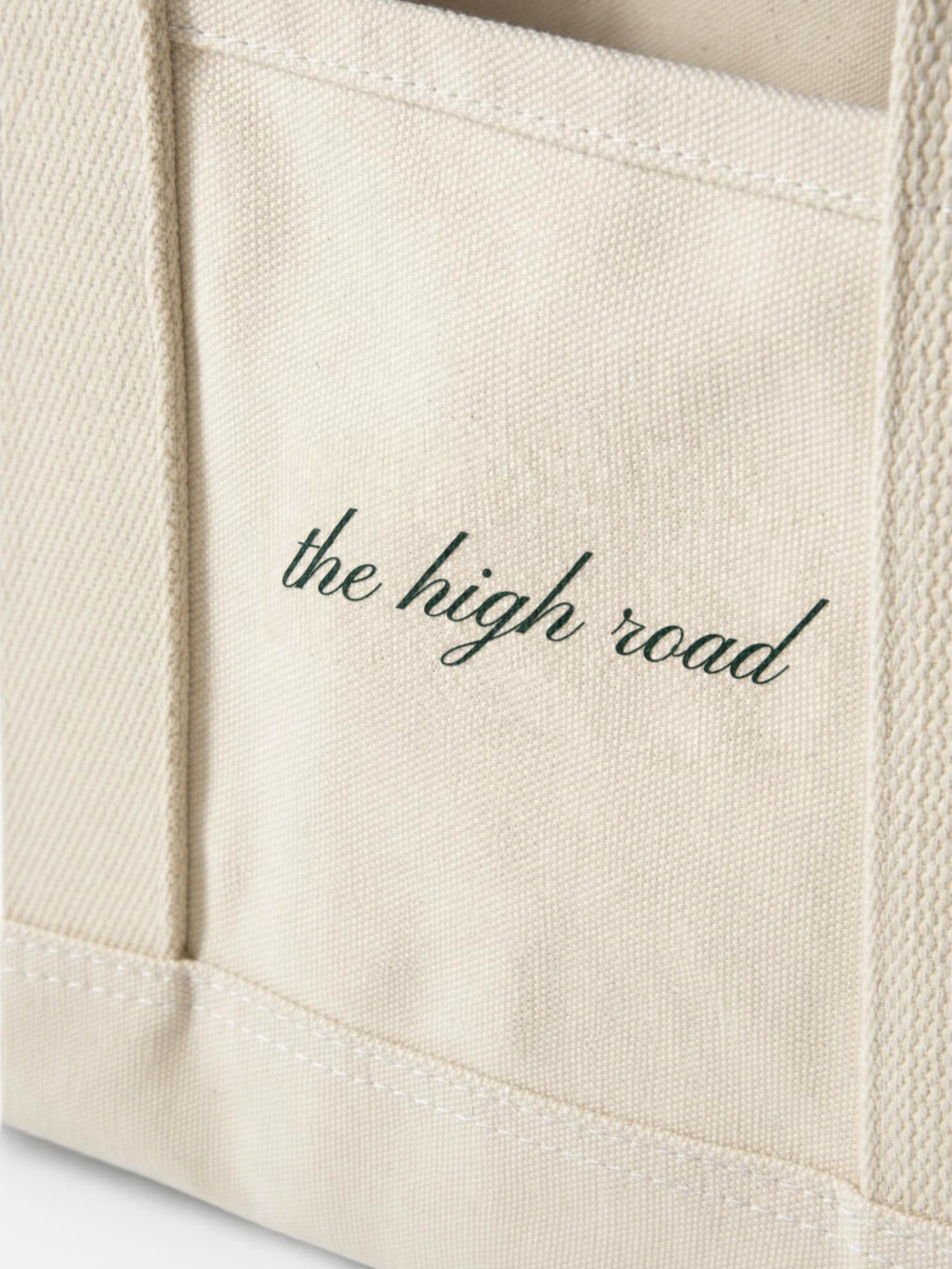 Veronica Beard Off-white canvas tote bag with cursive text detail.