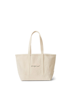 Veronica Beard Beige canvas tote bag with black cursive text.