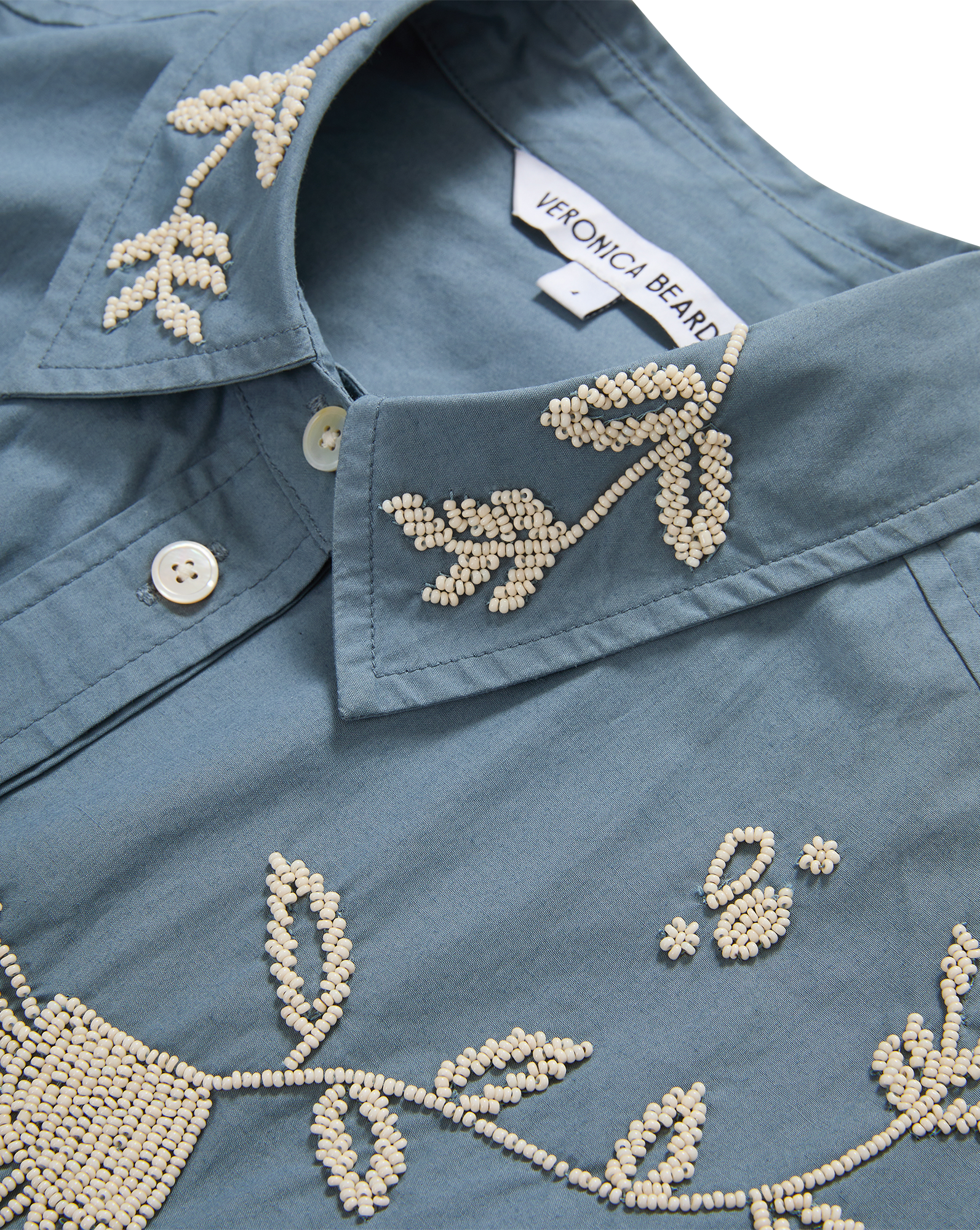 Veronica Beard Blue cotton shirt with white beaded embroidery.