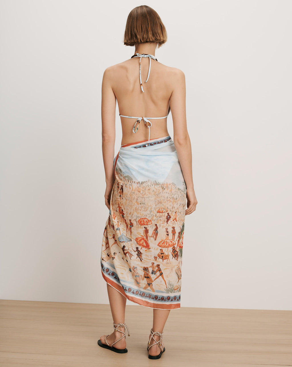 Veronica Beard White bikini top and light blue patterned sarong.