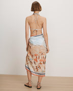 Veronica Beard White bikini top and light blue patterned sarong.