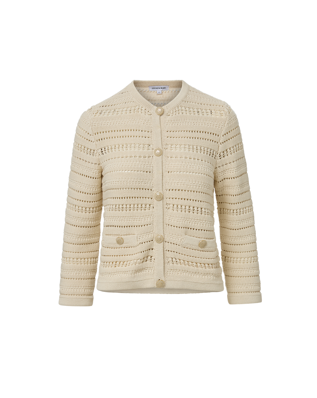 Veronica Beard Cream open-knit cardigan and light wash flared jeans.