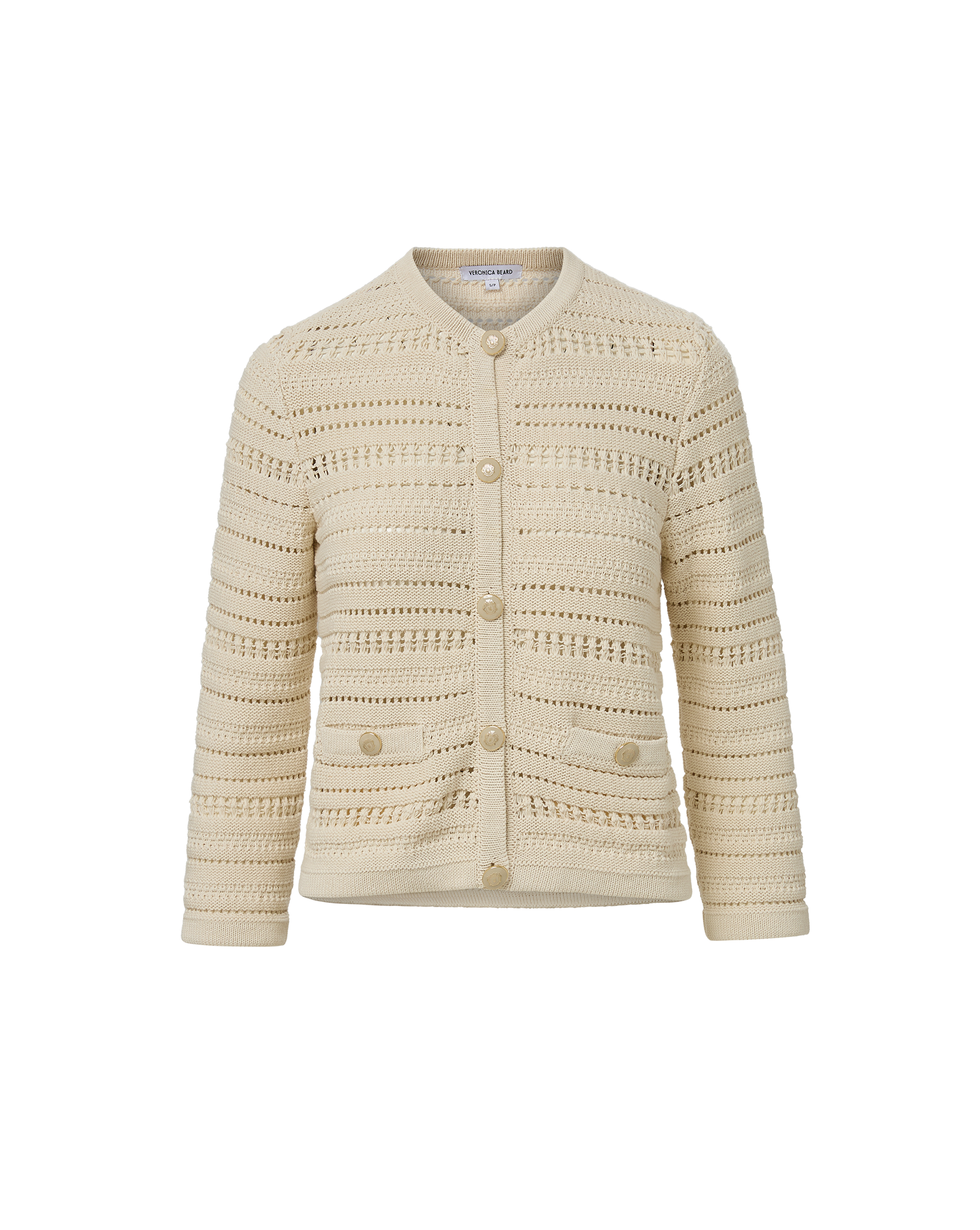 Veronica Beard Cream open-knit cardigan and light wash flared jeans.