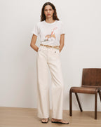Veronica Beard White graphic tee and cream wide-leg jeans with