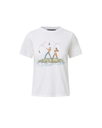 Veronica Beard White graphic t-shirt and blue geometric patchwork jeans.
