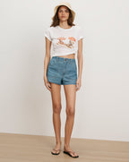 Veronica Beard White graphic t-shirt, blue denim shorts, straw hat,