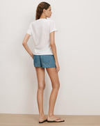 Veronica Beard White cotton crewneck t-shirt and blue denim shorts.