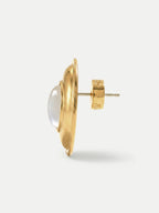 Veronica Beard Gold stud earring with a clear, domed cabochon