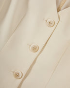 Veronica Beard Cream button-front vest with notched lapel.