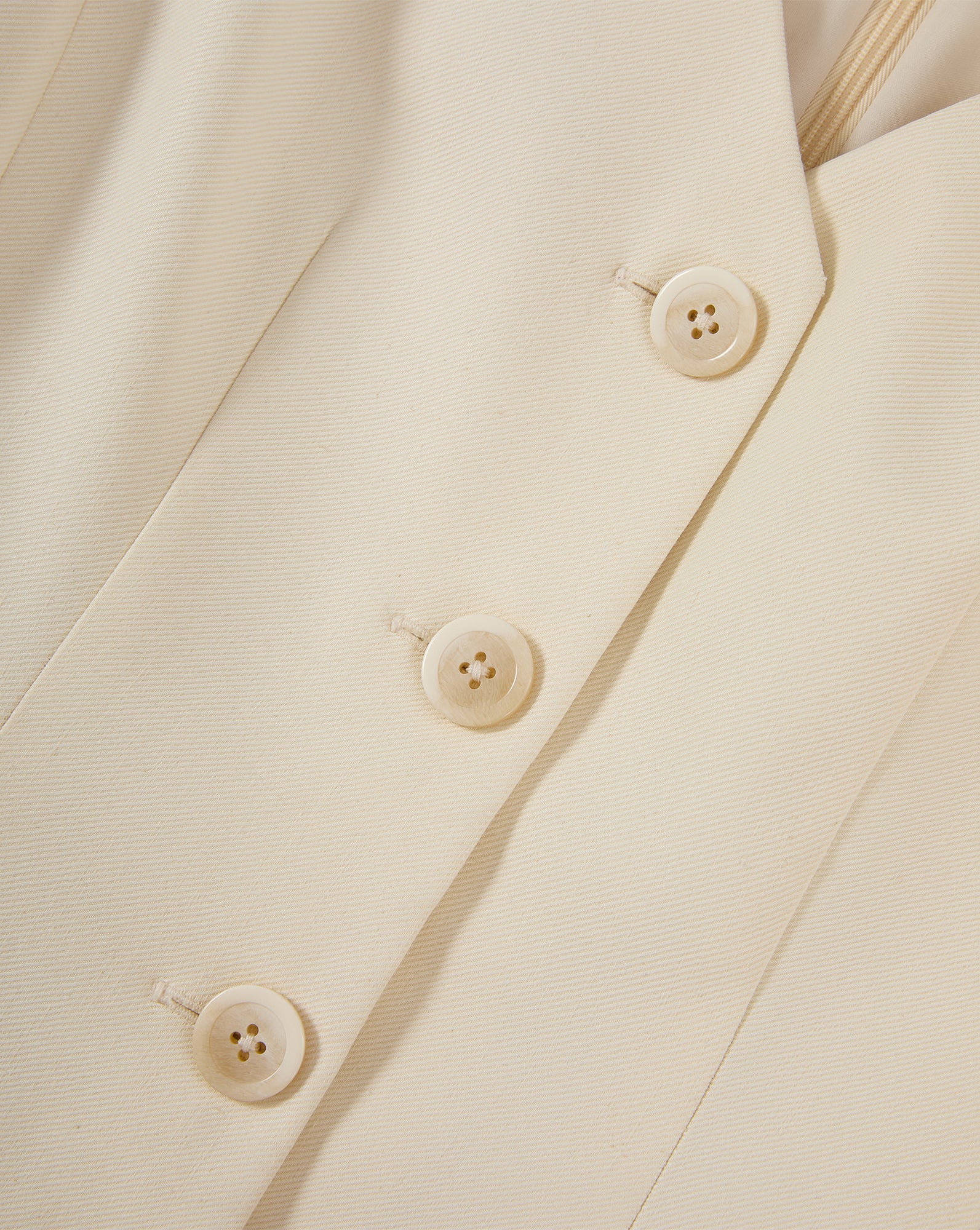 Veronica Beard Cream button-front vest with notched lapel.