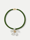 Veronica Beard Green beaded necklace with a white flower pendant.