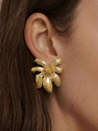 Veronica Beard Gold flower-shaped stud earring with textured petals.