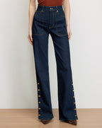 Veronica Beard Dark wash denim wide-leg jeans with side buttons.