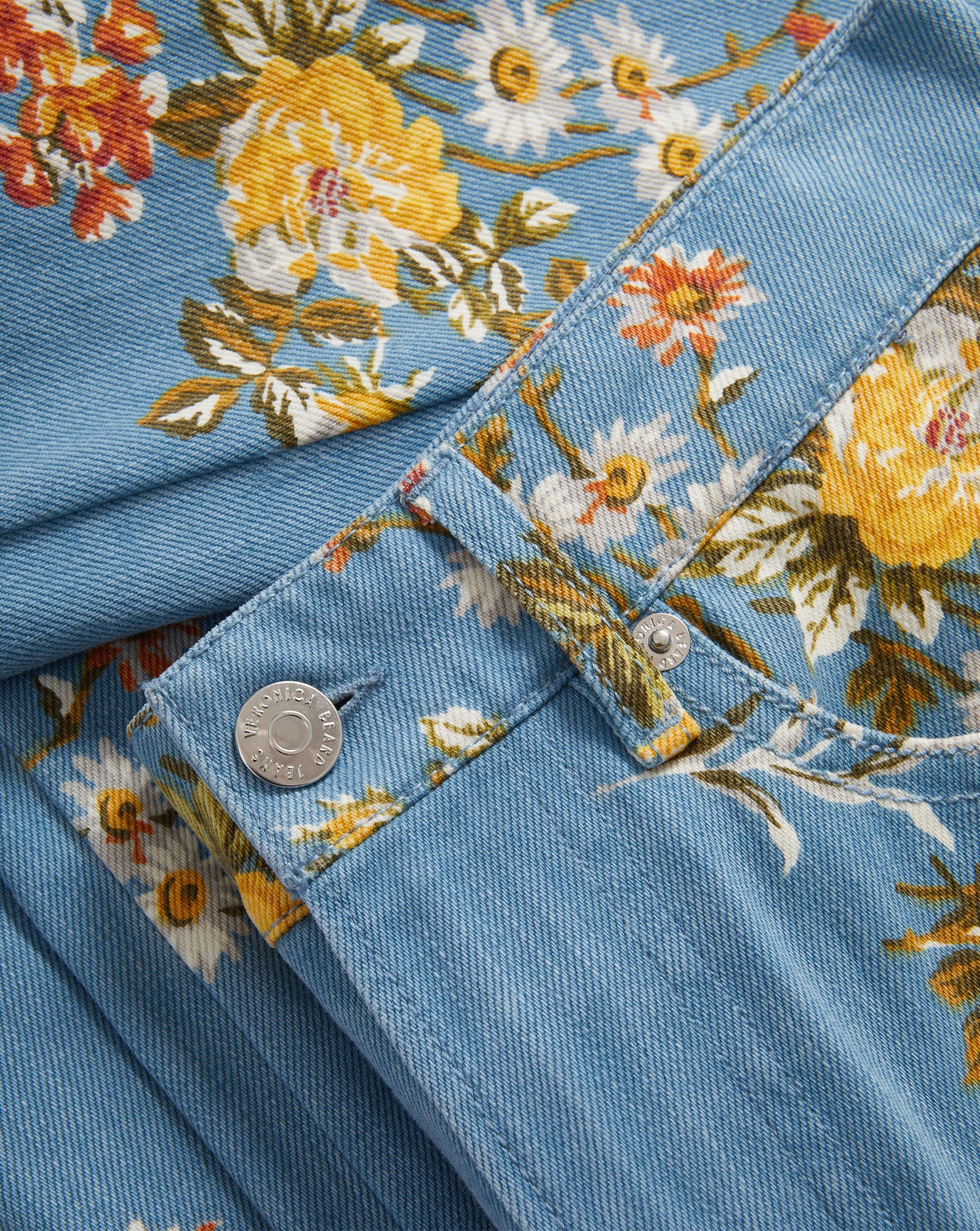 Veronica Beard Blue floral denim jacket and matching flared jeans.