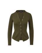 Veronica Beard Olive green ribbed knit cardigan, blue flared jeans.