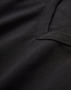 Veronica Beard Black t-shirt and dark gray wide-leg jeans with