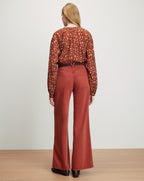Veronica Beard Rust wide-leg jeans and a brown patterned long-sleeve