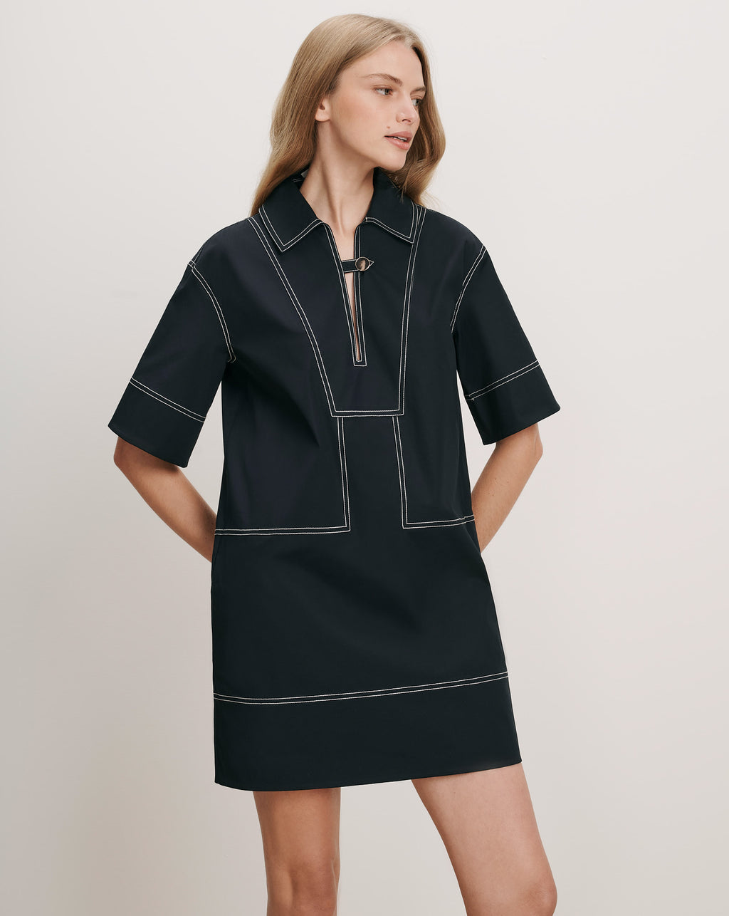 Veronica Beard Black cotton polo dress with white contrast stitching.