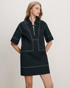 Veronica Beard Black cotton polo dress with white contrast stitching.