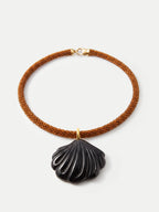 Veronica Beard Brown beaded necklace with a black shell pendant.