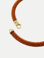 Veronica Beard Orange beaded necklace with gold clasp.