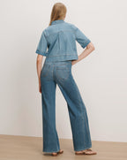 Veronica Beard Blue denim short-sleeve shirt and wide-leg jeans.
