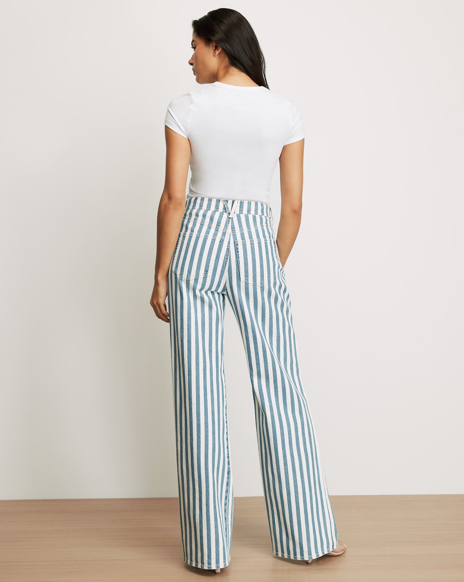 Veronica Beard White and teal striped wide-leg jeans.