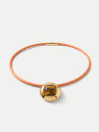 Veronica Beard Orange leather choker with a gold pendant and