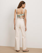 Veronica Beard Cream wide-leg jeans and a printed camisole.